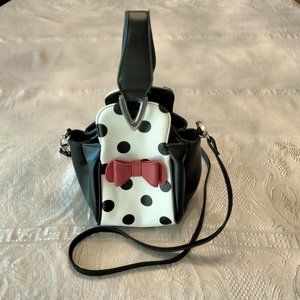 Adorable polka dot purse with red bow